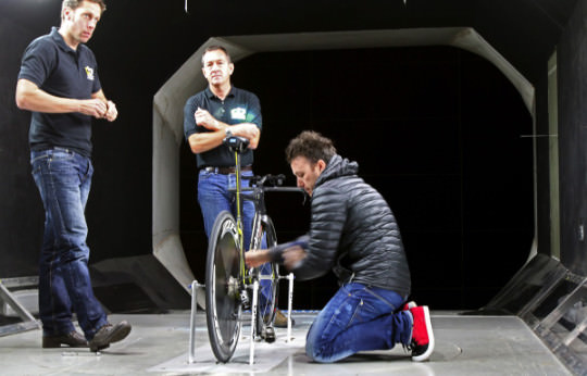 Chris Boardman and engineers in the wind tunnel